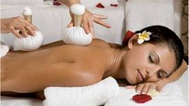 Bradford Massage is a form of relaxation therapy that offers tranquil healing to individuals, including a woman who is enjoying a soothing massage session.