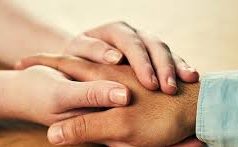 A person is experiencing relaxation therapy through a soothing Bradford massage while holding another person's hand.