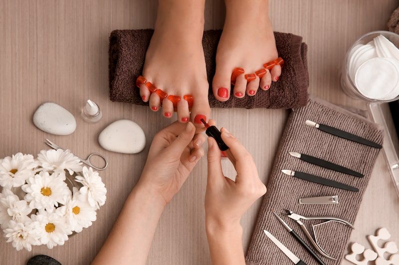 Ar Holistic Therapy - Bradford - Sanam Satti's holistic & beauty salon offers exceptional nail services, where a woman indulges in getting her nails done by a skilled manicurist.