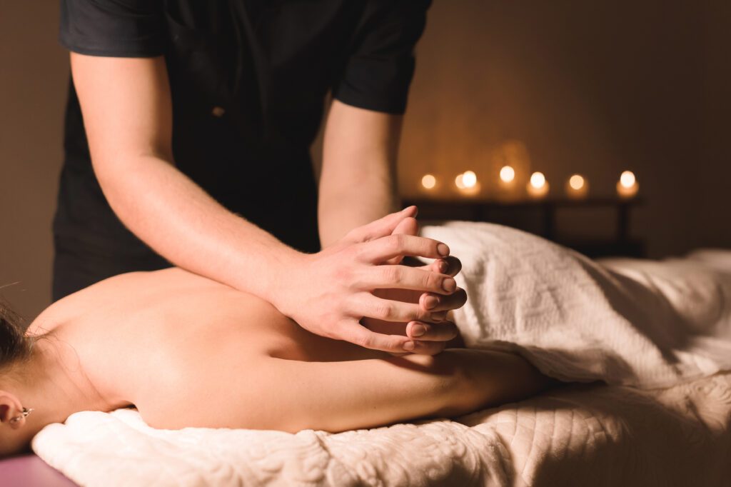 Ar Holistic Therapy - Bradford - Experience the transformative power of touch as a woman indulges in a blissful spa massage.
