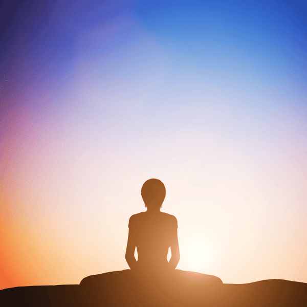 Ar Holistic Therapy - Bradford - A spiritual silhouette of a person meditating at sunset.