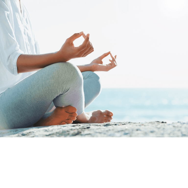 Ar Holistic Therapy - Bradford - A woman in deep contemplation, finding solace and peace while meditating on the tranquil beach.