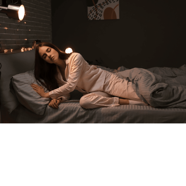 Ar Holistic Therapy - Bradford - A woman asleep on a bed in a dimly lit room.