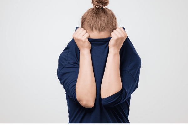 Ar Holistic Therapy - Bradford - A woman, overwhelmed with guilt, covering her face with her hands.